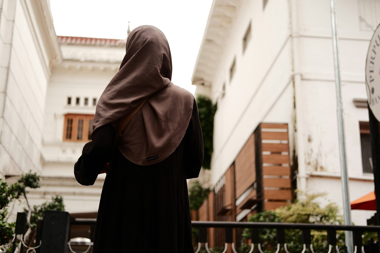 a woman in a nun outfit walking down a street