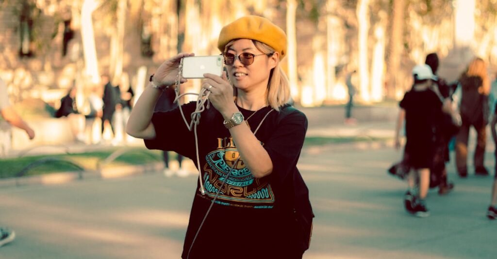 Woman wearing a yellow beret takes a photo outdoors, capturing urban life.